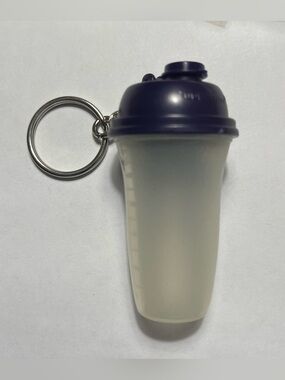 1 Tupperware Mini Shaker Bottle Keychain. Approximately 2 1/2 inches tall.